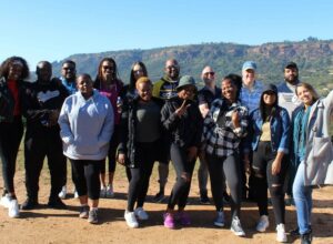 a shot of a group stood outside. this group consists of members of Money Carer, and Sprout Foundation, in South Africa.